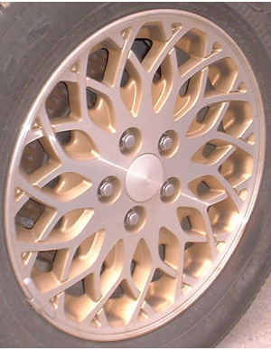 98 CHRYSLER TOWN & COUNTRY 16x6.5 15 Crossed Pt Spiral Mesh MACHINE/GOLD