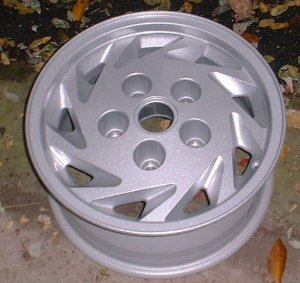 92-94 FORD E150 VAN 15x7 Slanted 9 Slot with Open Lugs A SILVER