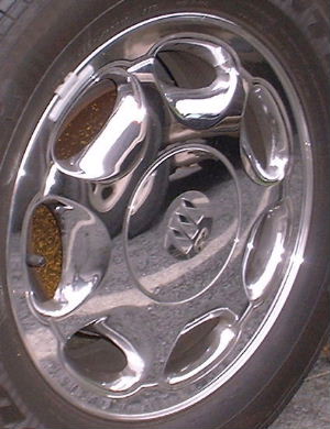 97-00 BUICK PARK AVENUE 16x6.5 7 Slot with Covered Lugs CHROME, OPT P05