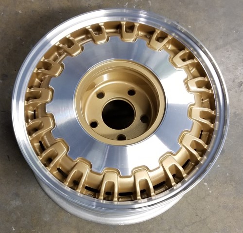 97-99 CADILLAC DEVILLE 16x7 Paired Notched 32 Rib MACH/GOLD, OPT QC2
