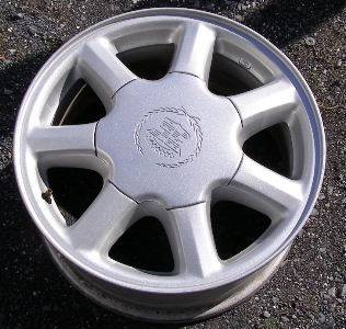 96-97 CADILLAC SEVILLE STS 16x7 Thin 7 Spoke w Covered Lugs SILVER