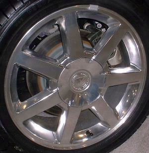 09 CADILLAC CTS 17x7.5 7 Spoke w Covered Lugs POLISHED, OPT PTB