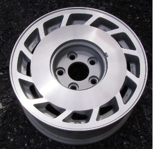 87 NISSAN 300ZX 15x6.5 Slanted 12 Slot with Covered Lugs MACHINE/SILVER