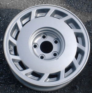 88-89 NISSAN 300ZX 15x6.5 Slanted 12 Slot with Covered Lugs SILVER