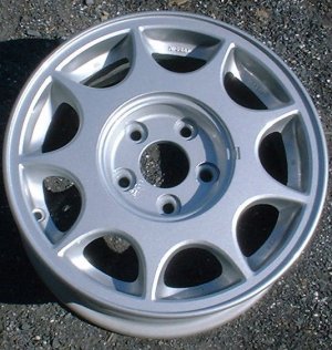 89-90 NISSAN MAXIMA GXE 15x6 9 Hole with Covered Lugs A SILVER