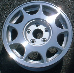 91-94 NISSAN MAXIMA GXE 15x6 9 Hole with Covered Lugs B MACHINE/SILVER