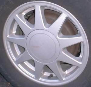 90-92 NISSAN STANZA GXE 14x6 9 Spoke with Covered Lugs SILVER