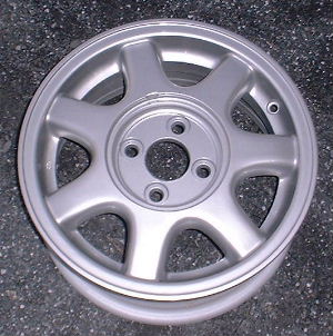 91-93 NISSAN NX 14x6 Soft 7 Spoke with Covered Lugs SILVER