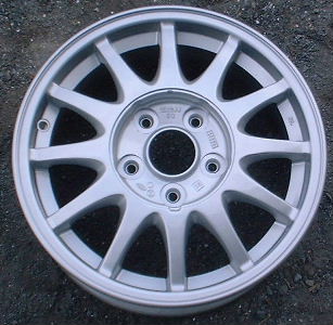 93-95 MAZDA 929 15x6 Thin 12 Spoke with Covered Lugs SILVER