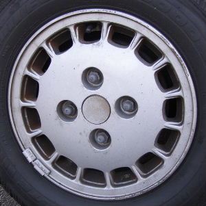 90-91 DODGE COLT VISTA 13x5 Flat 15 Slot with Exposed Lugs SILVER